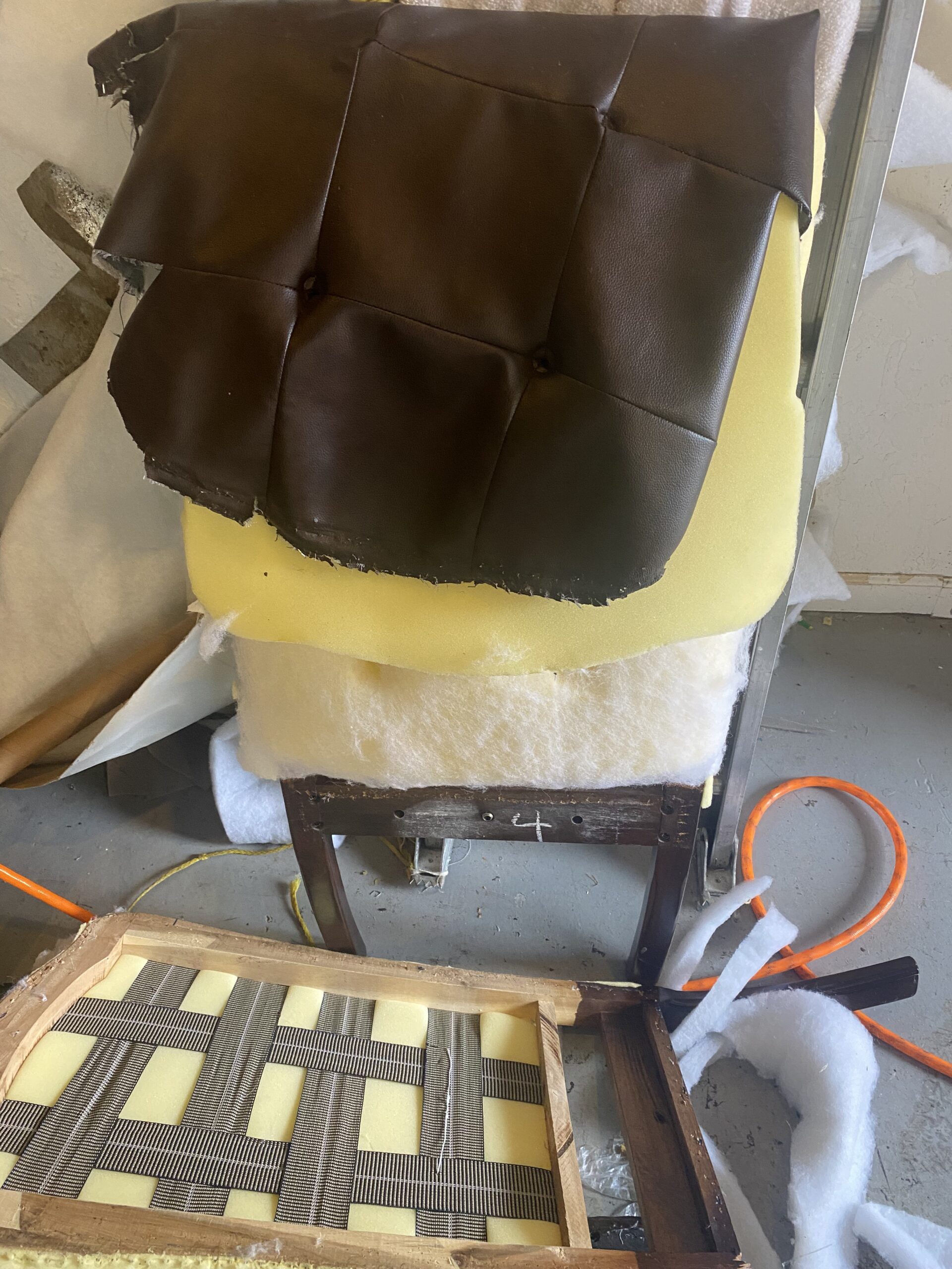 a chair with a brown cushion