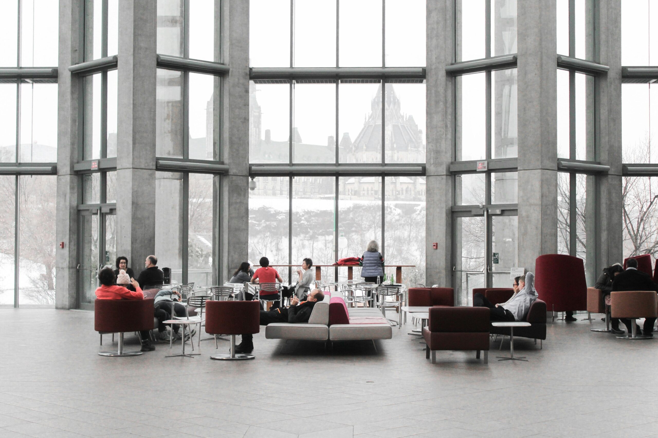 Educational Upholstery in a university lounge Spacious lounge with modern decor and large windows showcasing a snowy Ottawa view.