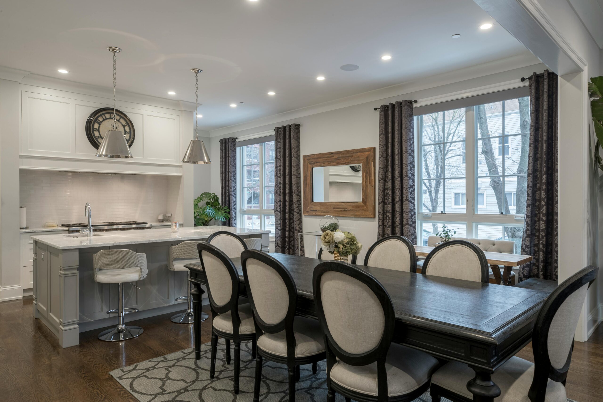Stylish and contemporary kitchen and dining area with chic furniture and natural lighting.