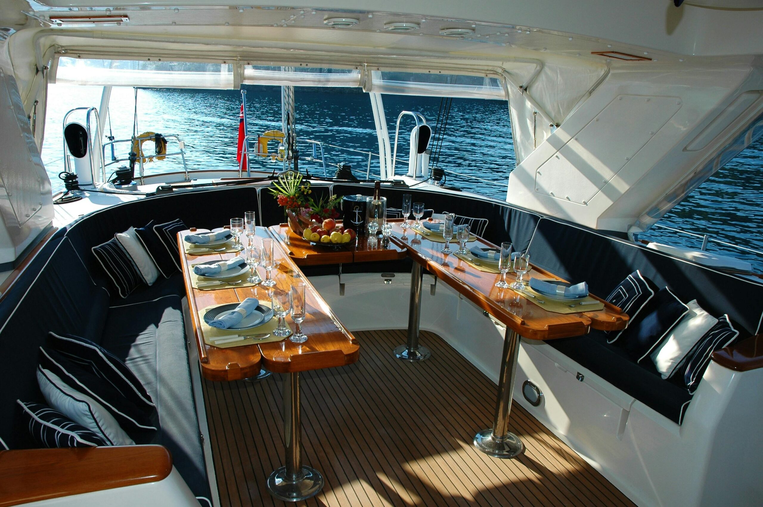 Boat Upholstery Repair Marine Upholstery Boat Upholstery by Chair Care Upholstery in Hollywood, Florida Luxurious yacht deck with an elegantly set dining table overlooking the tranquil sea.