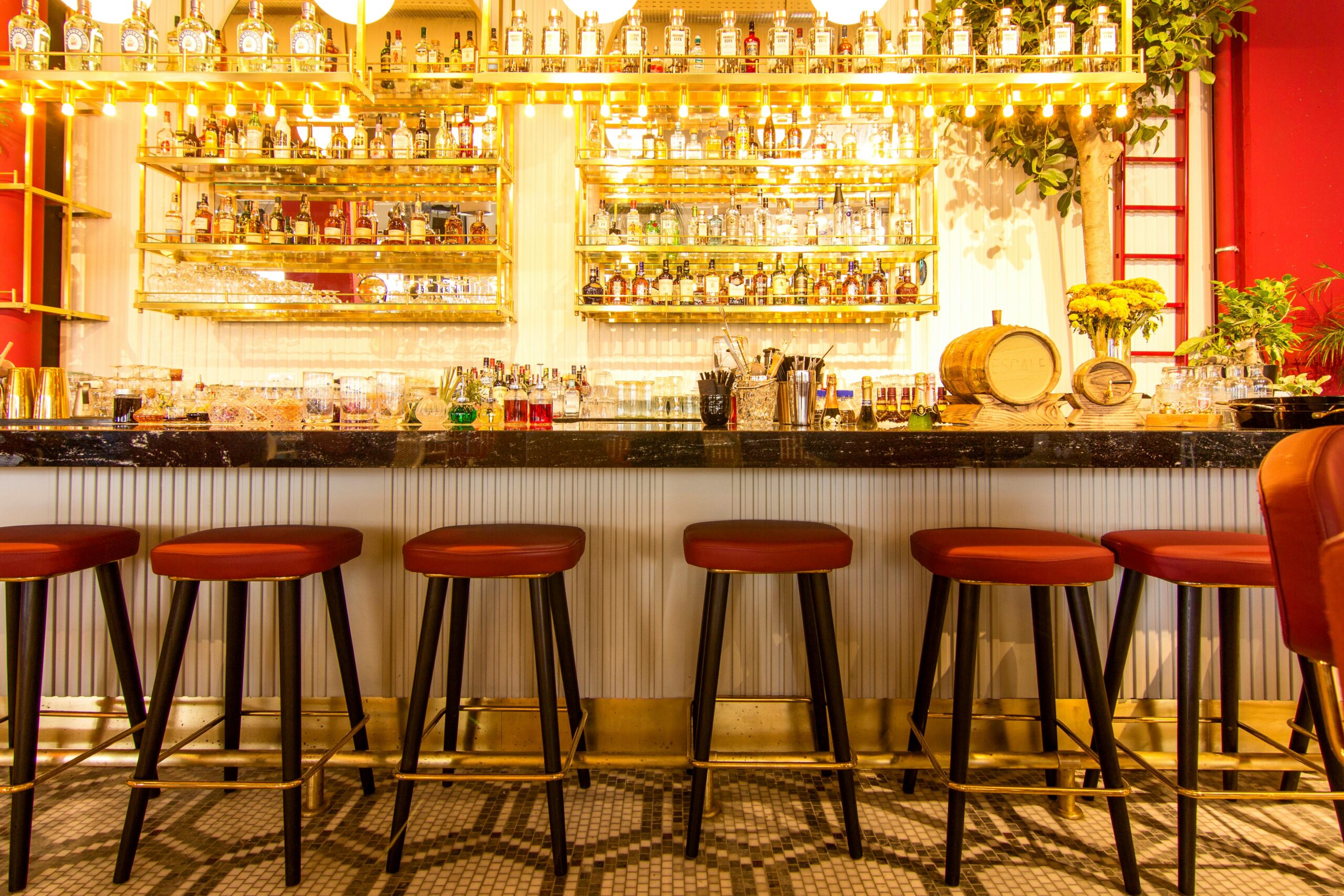 Expert Bar Upholstery Services in Hollywood, FL | Chair Care Sophisticated bar setup featuring sleek stools and a vibrant atmosphere.